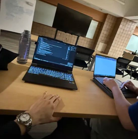 Team working on quant challenge code