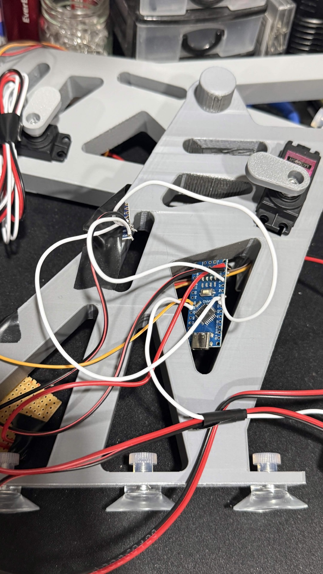 The assembled electronics mounted in the wing bracket with wiring routed through the lattice