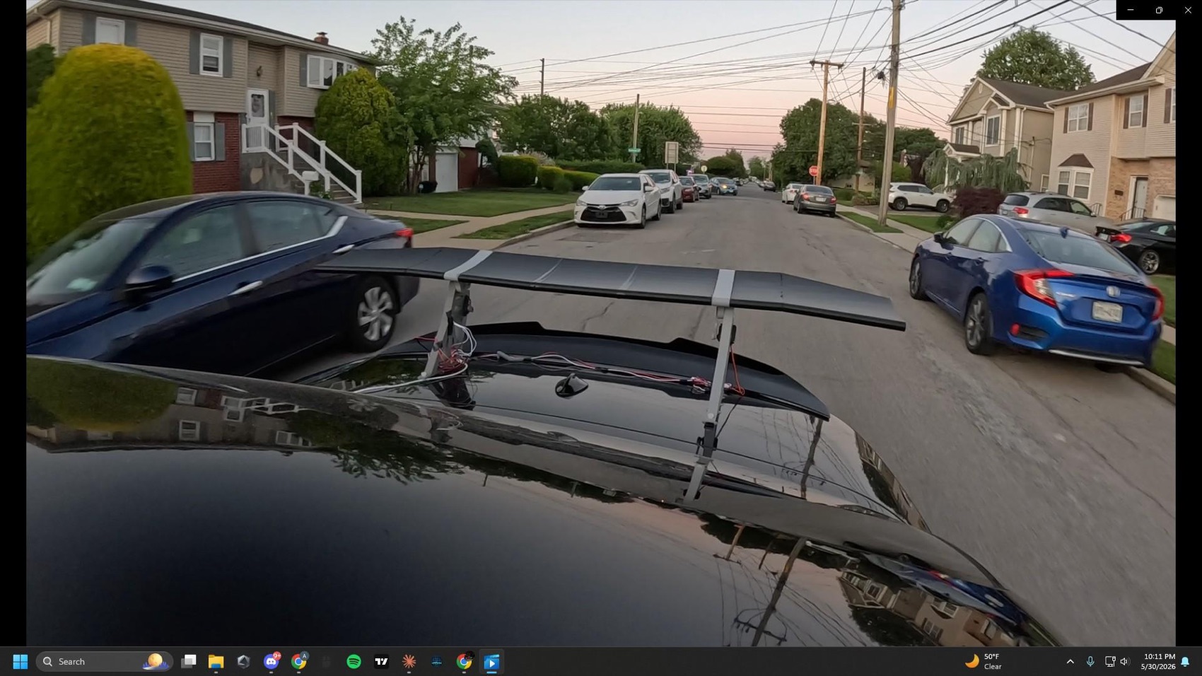 The wing mounted on the car during an on-road test run through a neighbourhood