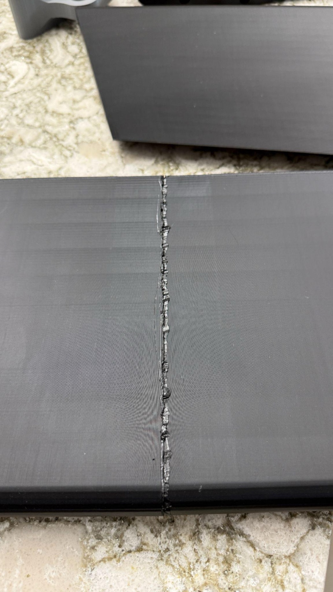 Close-up of a plastic welded seam between two wing modules