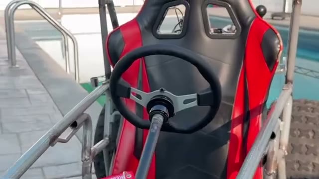 Go-kart chassis, side view, poolside